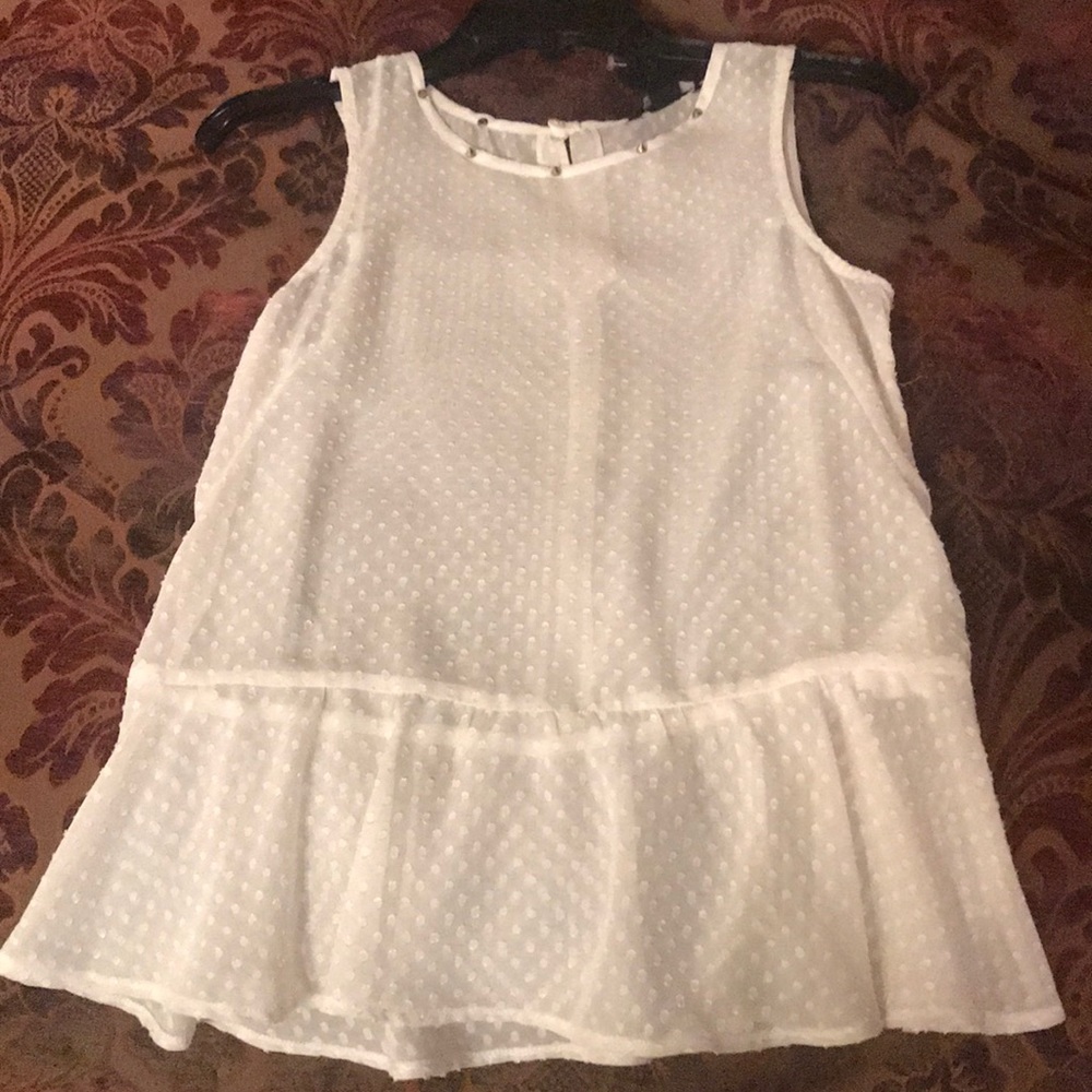 White peplum sleeveless top